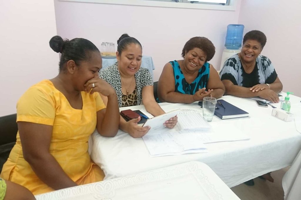 BES staff with local partners